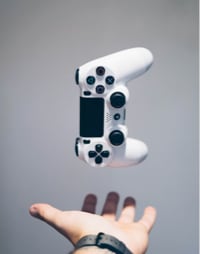 Image of PS4 controller being thrown in the air